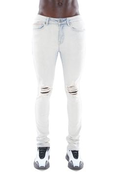 These super-skinny stretch-denim jeans are given a punk-rock update with a light wash and threadbare knees that elevate the lived-in aesthetic. Iridescent side stripes and X markings at the back further the fun. 86% cotton, 10% spandex, 4% polyester Machine wash, line dry Imported Urban Fitted Distressed Bottoms, Urban Style Distressed Fitted Jeans, Urban Distressed Fitted Jeans, Ripped Fitted Punk Jeans, Punk Ripped Fitted Jeans, Punk Style Ripped Fitted Jeans, Fitted Ripped Punk Jeans, Edgy Light Wash Cotton Bottoms, Fitted Punk Jeans With Five Pockets