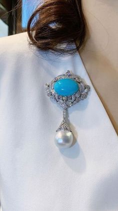 Elegant Blue Gemstone Brooches, Elegant Blue Gemstone Brooch, Luxury Turquoise Brooches, Luxury Turquoise Brooches For Gift, Elegant Blue Oval Brooches, Elegant Oval Blue Brooches, Turquoise Brooch For Formal Occasions, Elegant Diamond Gemstone Brooches, Elegant White Gold Brooches With Gemstone