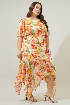 Take on the day in this spritely floral midi dress. A spirited floral print with silver pinstriping is woven into a sheer and flowy fabric. It shapes the Aerin Midi, a flowy dress with sheer, flouncy sleeves frame a lined bodice and asymmetrical skirt. An imbalanced hemline creates an ethereal touch. An elastic waistband is placed along the back side, as well as a keyhole.- Keyhole- Lined- Asymmetrical hem- Elastic waist- Color: Blush MultiSize + Fit - Model is 5'9" and wearing size 2X- Measurem Summer Floral Print High-low Hem Dress, Summer Floral Print Dress With High-low Hem, Spring Garden Party Dress With High-low Hem, Beach Dress With Floral Print And High-low Hem, Spring Maxi Dress With Asymmetrical Hem For Garden Party, Flowy Floral Print High-low Hem Midi Dress, Flowy High-low Hem Midi Dress With Floral Print, Flowy Floral Print Midi Dress With High-low Hem, Flowy High-low Hem Dress For Spring