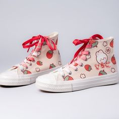 Features: Bring the cute to your outfit in these super adorable Kawaii Strawberry Bunny High-Top Canvas Shoes. These shoes are great for giving your casual wear that extra pop of kawaii personality. They make a great gift for anyone who loves adorable things, and are sure to be a hit! Made with high-quality canvas material to be both durable and comfortable to wear. The outsole material is made with rubber, giving it added protection against outside elements such as dirt and water. **These custo Cute Flat Sneakers For Summer, Trendy Canvas Shoes With Round Toe, Trendy Round Toe Canvas Shoes, Cute Summer Sneakers, Cute Flat Heel Sneakers For Spring, Fun Cartoon Print Sneakers With Round Toe, Cute Cartoon Print Sneakers For Streetwear, Cute White Sneakers With Cartoon Print, Trendy Low-top Sneakers With Cartoon Print