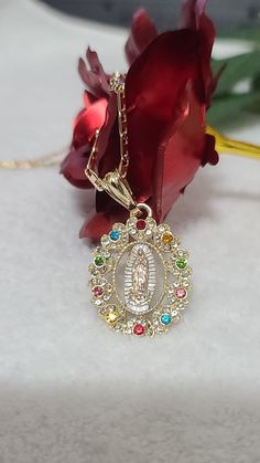 "Virgin Mary (Guadalupe Virgin) with Roses Necklace - Two Style. Special Mother's Day, Father's Day, Valentine's Day, Easter, Christmas, or any holiday! Gorgeous Virgen de Guadalupe Pendant with zircon Measurements: Chain - 09 inch. from top to bottom (16-18\" Long from end to end) Measurements: Chain - 12 inch. from top to bottom (23-24\" Long from end to end) *ABOUT US* \"Ashley Accesorios\" is an online retailer based in Lacey, Wa. Our goal is to provide the BEST QUALITY items at AFFORDABLE P Quince Planning, Mary Guadalupe, Quinceanera Jewelry, Mary Necklace, Virgin Mary Necklace, Pretty Jewelry Necklaces, Catholic Books, Catholic Jewelry, Jewelry Fashion Trends