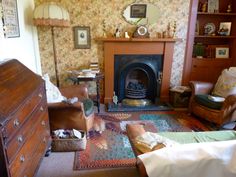 a living room filled with furniture and a fire place