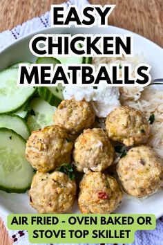 a white plate topped with meatballs next to rice and cucumbers