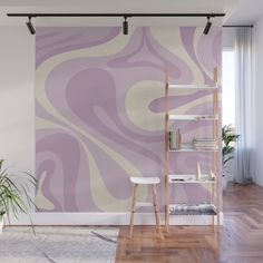 a purple and white swirl wall mural in a living room with wooden floors, shelves, and potted plant