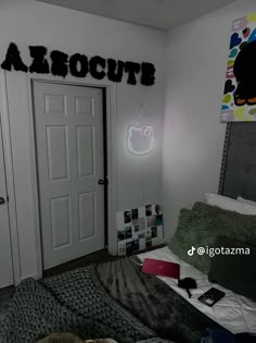 a bedroom with a bed and two doors that say afrocutt on the wall