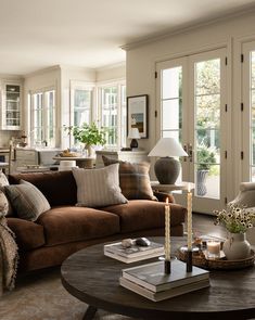 a living room filled with lots of furniture and decor on top of a wooden table