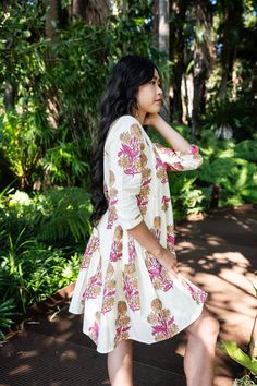 Model is 167 cm tall and is wearing size S This white printed cotton sundress is fully lined, featuring a mandarin collar, three-quarter sleeves, and a flared hem. Pattern: Floral Neck: Collared Fit: Flared Sleeve: Three-Quarter Sleeves Fabric: Cotton Fabric Care: Hand Wash Cotton Sundress, Printed Cotton Dress, Pattern Floral, Mandarin Collar, Dress Clothes For Women, Flared Sleeves, Three Quarter Sleeves, Cotton Dress, Cotton Dresses