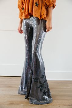 Get ready to turn heads and shine bright with our STAR SEQUIN FLARES! These fun and exciting pants feature all-over sequins that are sure to make you stand out from the crowd. Embrace your unique style and sparkle everywhere you go! All orders are currently shipping within 14 business days. To receive item quicker, expedited shipping is available at checkout. **ALL HALLOWEEN ORDERS MUST BE PLACED WITH EXPEDITED SHIPPING TO GUARANTEE DELIVERY BY OCT. 31 IF PLACED AFTER OCT. 15** Flair Pants, Oct 31, Shine Bright, New Outfits, Unique Style, Sequin, Give It To Me, Sparkle, Turn Ons