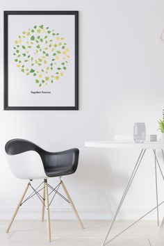 a white table with two black chairs and a green plant on the wall above it