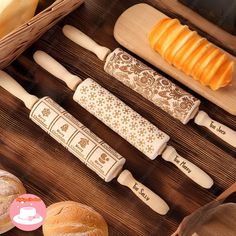 an assortment of breads and pastries on a wooden table