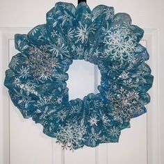 This adorable Snowflake Wreath lights up at night with the use of LED lights. Add this 18" wreath to home decor to bring in Christmas. Product Dimensions: 18" round x 3.5" depth Product Weight: 1.5lb Product Materials: wire frame, zip ties, felt, deco mesh, plastic ornaments and LED lights Indoor only Wreath Lights, Snowflake Door Wreath, Blue Snowman Wreath, Blue Snowflake Wreath, Snowflake Wreath, Zip Ties, Wire Frame, Door Wreath Hanger, Deco Mesh