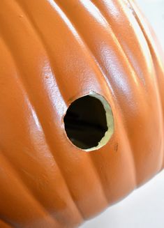 a close up of a pumpkin with holes in it