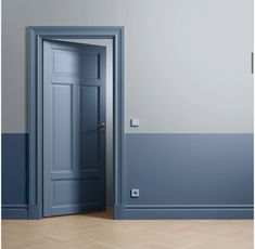 an open door in a room with blue walls and parquet flooring on the wooden floor