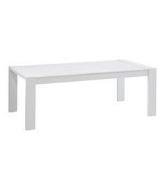 a white table sitting on top of a white floor