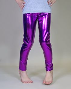 Glitzy, shimmery, metallic pants, while lightweight fabric little ones comfy. These glam pants are fun, fashionable and your little lady will love wearing it with their perfect amount of pizazz and shine.  100% polyester  We recommend hand washing and hang drying this article of clothing to keep the metallic shine from fading * 3 year - 21" waist / 23 1/2" length * 4 year - 21 1/2" waist / 25" length * 5 year - 22 1/2" waist / 26 1/2" length * 6 year - 24" waist / 27 1/2" length * 7 year - 26 1/ Shiny Stretch Bottoms For Party Season, Metallic Shiny Bottoms For Party Season, Tight Pants For Spring Party, Pink Stretch Leggings For Party, Pink Party Leggings, Pink Tight Leggings For Party, Party Full-length Leggings, Metallic Fitted Leggings For Party, Purple Tight Tights For Party