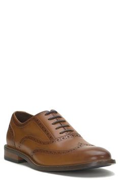 Stylish broguing lends vintage-inspired style to a polished leather oxford set atop a navy-blue rubber sole for slip-free strides. Leather upper/textile lining/rubber sole Imported Cognac Wingtip Oxfords With Leather Lining, Cognac Wingtip Oxfords For Business Casual, Semi-formal Cognac Oxfords With Brogue Detailing, Cognac Oxfords With Brogue Detailing For Work, Cognac Round Toe Oxfords With Leather Lining, Vintage Oxfords With Leather Footbed For Work, Leather Oxfords With Brogue Detailing In Cognac, Cognac Round Toe Oxfords For Office, Leather Cognac Oxfords With Brogue Detailing