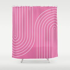 a pink shower curtain with white lines in the middle and an abstract design on it