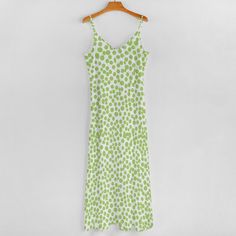 FREE SHIPPING This striking maxi dress showcases a vibrant green backdrop that sets the stage for a playful, retro-inspired floral pattern with pops of pale green. • Material: 95% polyester + 5% spandex, lightweight and slightly elastic.• Features spaghetti strap and ankle length, simple but stylish.• Suitable for daily wear for home, out and shopping.• Machine washable in cold water. Do not bleach and soak for a long time. Long Dress Green, Dragonfly Dreams, Womens Long Dresses, Green Backdrops, Ankle Length Dress, Hoodies Mens, Green Material, Matches Fashion, Women Long Dresses