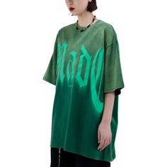 This stylish t-shirt from MADE EXTREME will take your style to a new level. The gradient Street Letter design will draw all eyes to you. This lightweight, breathable fabric will keep you feeling comfortable all day. Features: -90% Cotton, 10% Spandex -Dropped shoulder -Bold letter graphic -Regular fit -Unisex street style Oversized Green Graphic T-shirt, Trendy Green Top With Graphic Design, Green Urban T-shirt For Summer, Green Slogan Top For Streetwear, Urban Green Tops With Text Print, Trendy Green Slogan T-shirt, Trendy Green T-shirt With Slogan, Green Urban Top With Text Print, Green Graphic T-shirt For Summer