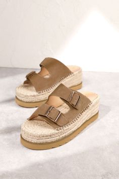 Women's Woven Platform Two Strap Slip-On Sandals Hazel Slide-On Sandals Slip on these Hazel Slide-On Sandals for effortless style and comfort. The open toe and back, adjustable straps with buckle details, and woven platform embody boho chic. Perfect for a trendy, playful summer look! Shop more of our Shoes, here! Details Available in sizes: 6-10 Available in colors: White and Taupe Slip-on design Open toe﻿ Open back Two straps Adjustable straps﻿ Buckle details Woven platform Bohemian Sandals With Buckle Closure For Summer, Closed Toe Footbed Sandals With Adjustable Strap For Vacation, Summer Adjustable Platform Footbed Sandals, Bohemian Sandals With Buckle Closure For Spring, Spring Bohemian Sandals With Buckle Closure, Spring Beige Platform Footbed Sandals, Beige Platform Footbed Sandals For Summer, Beige Platform Footbed Sandals For Spring, Summer Beige Platform Footbed Sandals