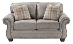 a gray couch with two pillows on it