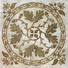 an intricately designed tile with acorns and leaves on it's surface