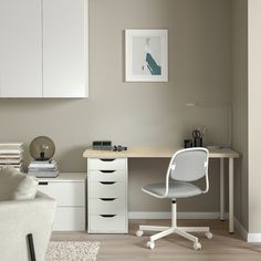 a white desk and chair in a room