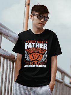 a young man wearing a t - shirt that says, every great father teaches his children to play american football