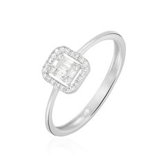 a white gold ring with an emerald cut diamond in the center and pave set shoulders