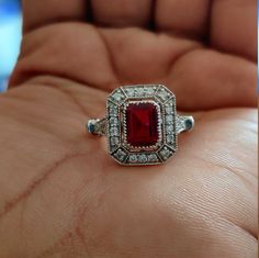 Vintage Art Deco Ring, Halo Diamond Ring, 2.05 CT Emerald Cut Red Garnet and Lab Diamond Ring* 925 Silver Ring, Halo Gifts Engagement Ring ✱ Our priority is to ensure our customers are 100% satisfied with their purchase. All jewelry is thoroughly inspected by our professional gemologist before it ships. Photos are enlarged to show details. ✱ What sets us apart? * Handcrafted / Handmade * Made to order * USA CERTIFIED NICKEL FREE - hypoallergenic & Environmental friendly * 5A highest Quality diam Garnet Diamond Ring, Silver Art Deco Engagement Ring, Art Deco Ruby Ring, Ruby And Diamond Engagement Ring, Art Deco Engagement Ring Vintage, Red Engagement Ring, Sunburst Ring, Garnet Ring Vintage, Oval Cut Diamond Rings