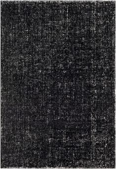 black and white textured background with small dots in the middle, on top of an area rug