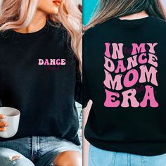 "In My Dance Mom Era Sweatshirt Dance Mom Sweatshirt Dance Mom Crewneck Dance Mama Sweatshirt Dance Mom Gift Dance Mom Sweater Dancemom Shirt I! Welcome to my store, It's really nice to see you here. Good news! 🎉 You're one step closer to touch somebody's life who you never met and make it's dreams come true! Celebrate the dance mom era of your life with our exclusive collection of \"Dance Mom Era\" Tees, Sweatshirts, and Hoodies! 💃 Our \"In My Dance Mom Era\" Sweatshirt is perfect for keeping cozy during those chilly recitals and dance competitions. Crafted for comfort, it's ideal for passionate dance moms like you. Choose from various styles, including crewnecks and pullovers, to match your preferences. You can also customize our gear with your name for a personal touch or gift it to a Dance Mom Gifts, Dance Competitions, Mom Crewneck, Personalized Sweater, Mom Sweater, Toddler Sweater, Dance Mom, Mom Era, Custom Design Shirts