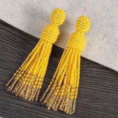 Champagne Gold Bead Tassel Earring -oscar de la renta tassel earrings Yellow Tassel Drop Earrings With Dangling Beads, Yellow Round Bead Earrings For Party, Yellow Tassel Earrings With Dangling Beads As Gift, Yellow Dangle Tassel Earrings Gift, Yellow Dangling Beads Earrings For Party, Adjustable Tassel Earrings With Colorful Beads For Party, Yellow Beaded Tassel Earrings As Gift, Yellow Dangle Tassel Earrings For Party, Yellow Tassel Drop Earrings For Party