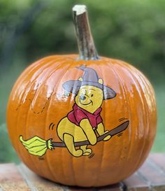 a winnie the pooh pumpkin sitting on top of a table