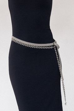 Inspired by celestial beauty, the Nova Silver Chain Belt features interconnected circular links adorned with metallic spheres that evoke the graceful rotation of planets and stars. Crafted from high-quality stainless steel, this stunning belt offers a sleek, polished finish that shines with cosmic allure. Designed for versatility, the Nova can be worn around the waist for a bold, modern statement or styled as a necklace to elevate any look. Whether you're dressing for a special occasion or addin Luxury Metal Chain Belt For Party, Luxury Metal Chain Belt For Formal Occasions, Luxury Silver Metal Chain Belt, Silver Chain Strap Belt For Evening, Luxury Chain Link Belt For Party, Luxury Silver Chain Belt For Formal Wear, Luxury Silver Chain Belt For Formal Occasions, Chic Silver Chain Belt For Party, Chic Silver Waist Chain