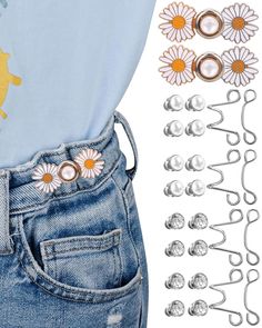 the back of a pair of jeans with flowers on it and two pairs of buttons