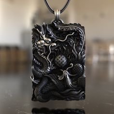 Experience the harmony of two of Asia's most iconic mythical creatures with our Dragon & Phoenix 925 Sterling Silver Necklace. This piece embodies the balance of yin and yang, representing the unity of opposites. The dragon, a symbol of strength, courage, and prosperity, intertwines with the phoenix, a symbol of renewal and rebirth. Expertly crafted from premium 925 sterling silver, the necklace showcases a detailed pendant reflecting the intricate artistry of Asian designs. Its unique design en Mythological Style Engraved Pendant Jewelry, Mythological Engraved Pendant Jewelry, Mythological Sterling Silver Pendant Necklace, Sterling Silver Mythological Pendant Necklace, Fantasy Style Engraved Necklaces For Gifts, Fantasy Style Engraved Necklace For Gift, Mythological Pendant Necklaces As Gifts, Antique Dragon Design Jewelry For Gift, Antique Dragon Design Jewelry Gift