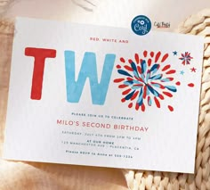 a birthday party card with the letter tw on it and fireworks in the background