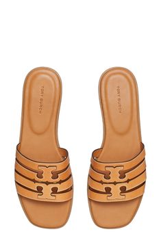 A dimensional Double-T logo stands out atop the strappy vamp of this breezy leather slide sandal. Leather upper and lining/rubber sole Imported Calf Leather Slip-on Sandals With Cushioned Footbed, Tan Leather Footbed Slip-on Sandals, Classic Open Toe Calf Leather Slides, Classic Slides With Removable Insole, Calf Leather Open Toe Slides, Designer Leather Slide Sandals, Classic Tan Sandals For Spring, Designer Calf Leather Slides With Leather Lining, Open Toe Slides With Leather Footbed And Calf Leather