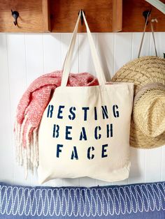 The RESTING BEACH FACE over sized canvas tote bag is a funny eye catching accessory for your coastal destination!  It makes a great gift and is perfect for a trip to the grocery store or market, to use as a beach bag, or everyday carryall.  Available with text in several colors... check out the variations!  This bag is made from 100% thick, sturdy canvas. AVAILABLE IN TWO SIZES * Large - 19.5" x 13" with a 4" gusset *Jumbo - 23" x 13" with a 6" gusset   These bags are hand painted using non-toxi Weekend Beach Season Cotton Canvas Bag, Cotton Canvas Bag For Beach Weekend, Cotton Canvas Bag For Weekend Beach Season, Weekend Beach Season Canvas Cotton Bag, Cotton Beach Bag With Letter Print For Vacation, Fun Cotton Canvas Travel Bag, Beach Canvas Bag With Letter Print, Fun Summer Cotton Canvas Bag, Fun Cotton Bag For Vacation