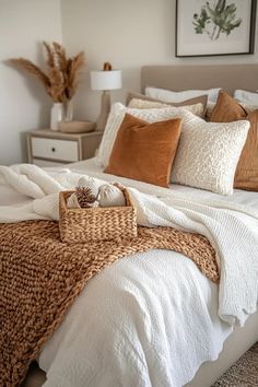 a bed with pillows and blankets on top of it