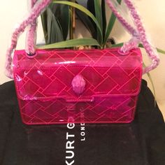 From Kurt Geiger London, The Clear Kensington Medium Vinyl Shoulder Bag Features: Pvc Exterior Flap Closure Approx. 8.66" W X 5.9" H X 2.75" D Color: Pink Imported. Designer Pink Bag With Magnetic Closure, Designer Pink Bags With Magnetic Closure, Custom Fitted Hats, Sequin Purse, Faux Fur Bag, Rainbow Bag, Pink Shoulder Bag, Fur Bag, Novelty Bags