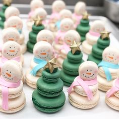 there are many small christmas trees made out of macaroons