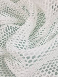 a close up view of white mesh material