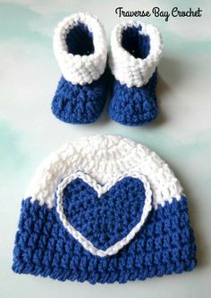 a crocheted hat and booties with a heart on it