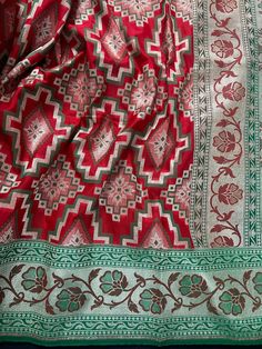 Stunning Semi Banarasi Silk Saree in Ikkat design with Paithani Style Borders in Red and Green combination. Item : SareeBase Fabric : Banarasi Silk Color : Red and Green Blouse piece : Comes with un-stitched Blouse piece.Blouse material :Banarasi Silk Work : HandloomFall & Edging(Yes/No) : Yes Disclaimer -:- Color variation is possible due to various reasons like phone or desktop setting, resolution etc. Please don't hold us responsible. Our aim is to put the exact color of the Saree.- If the Saree is Pure Silk, we will put it very clearly in our listing that it is Pure Silk. If we do not mention its Pure Silk please do not assume it is Pure Silk. When in doubt please feel free to check with us.- Thread coming out or zari coming out is NOT considered as a defect.- Since this Saree is handm Red And Green Combination, Ikkat Design, Green Combination, Men's Ethnic Wear, Banarasi Silk Saree, Bandhani Saree, Kanjivaram Sarees, Readymade Blouse, Kantha Stitch