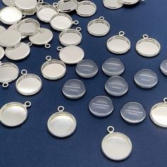 lots of silver colored metal discs on a blue surface