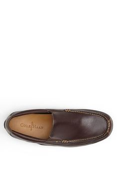 A padded insole and flexible rubber sole ensure comfort in a smart venetian loafer. Leather upper and lining/rubber sole. By Cole Haan; imported. Men's Shoes. Classic Slip-ons With Branded Insole, Synthetic Moc Toe Slip-ons With Rubber Sole, Business Casual Slip-ons With Ortholite Insole, Business Synthetic Slip-on Moccasins, Synthetic Slip-on Boat Shoes With Cushioned Footbed, Classic Slip-on Flat Boat Shoes, Slip-on Boat Shoes For Workwear, Business Slip-on Moccasins With Ortholite Insole, Classic Synthetic Moccasins With Round Toe