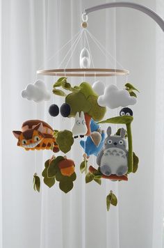 a mobile with animals hanging from it's sides