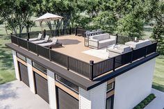 an artist's rendering of a house with patio furniture and umbrellas on the roof